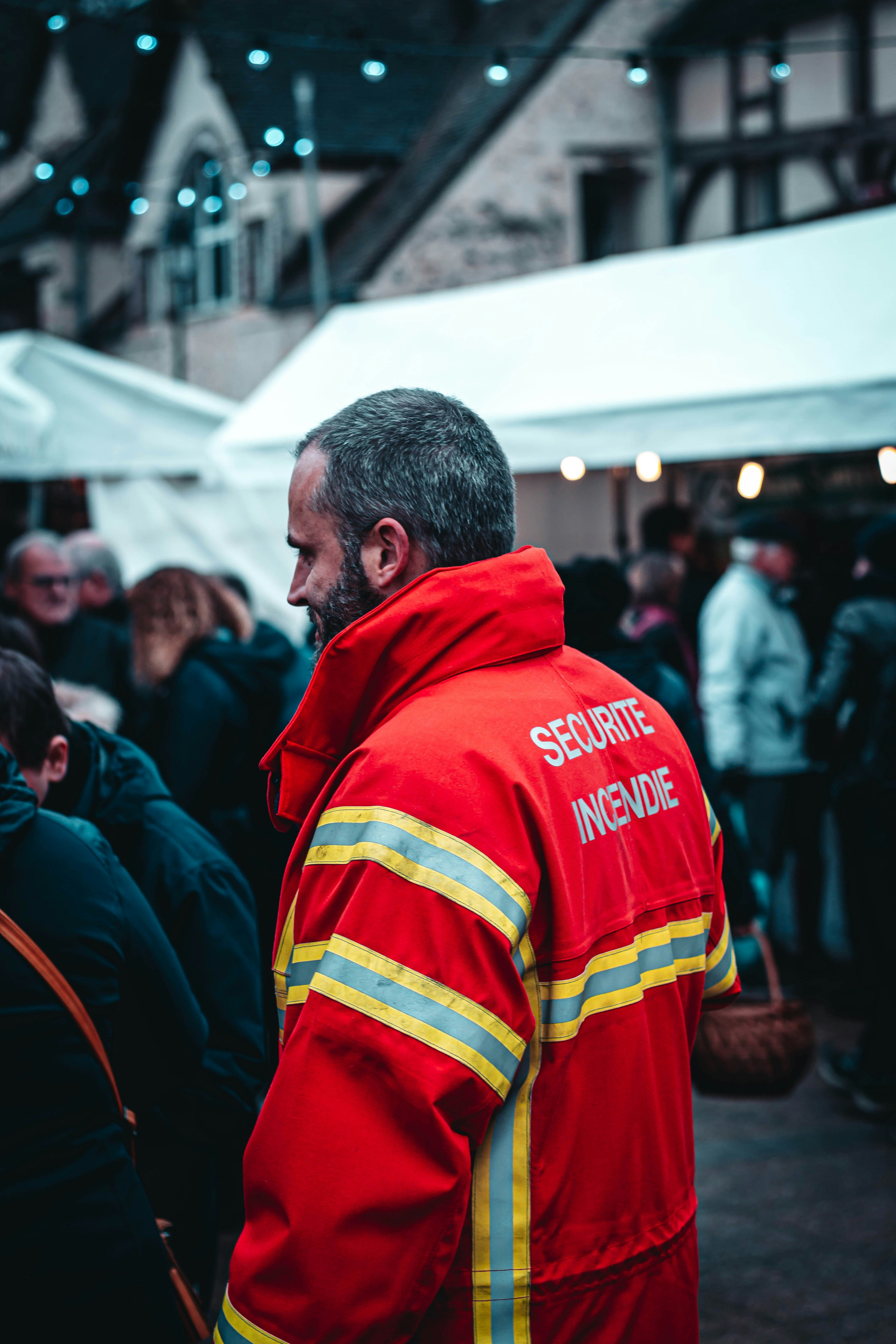 man wearing red coat